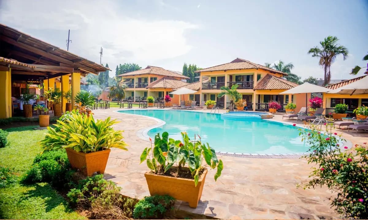 Pool and palm-filled courtyard at La Palmeraie Hotel in Bujumbura