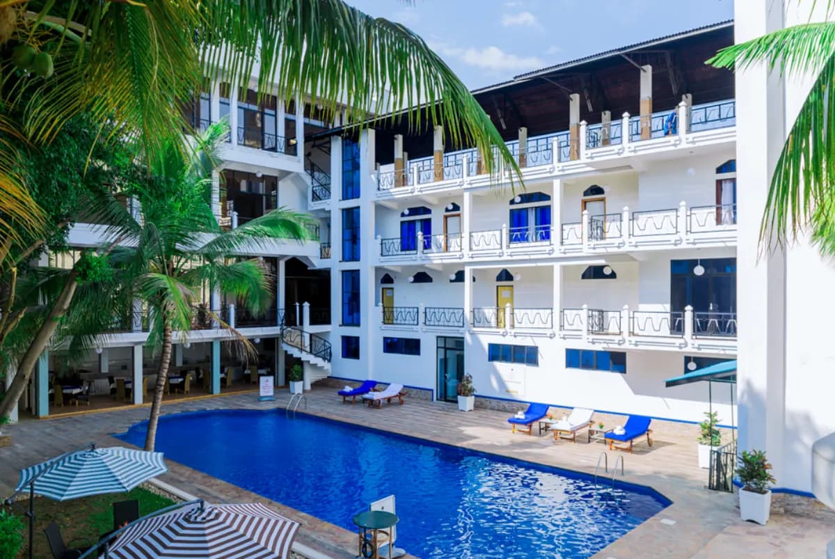 Pool courtyard and guest-room balconies at Mount Zion Hotel in Bujumbura